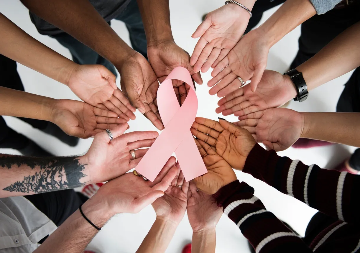 Hands in support of breast cancer